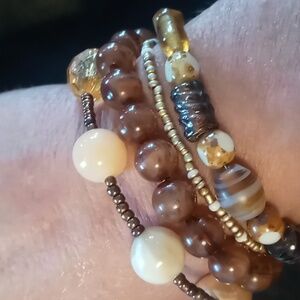 Four beaded bracelets glass beaded & resin.